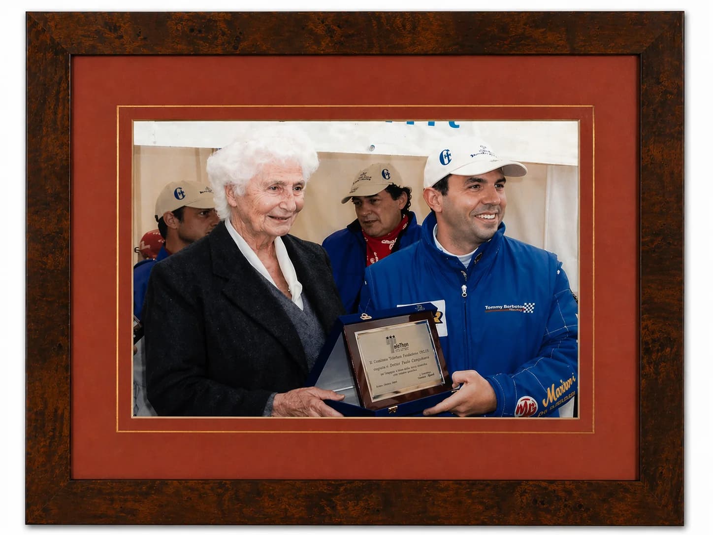 Framed photograph of Susanna Agnelli presenting the Telethon plaque to Paolo Campobasso in 2003
