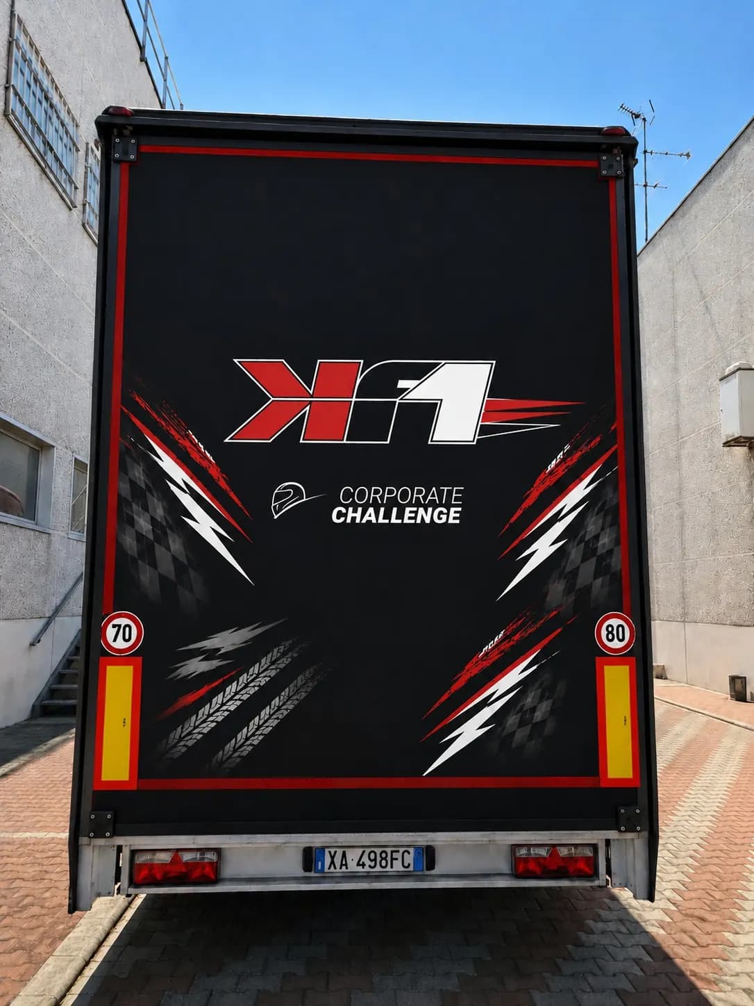 KF1 race transporters lined up at the circuit